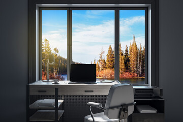 workplace in modern office interior with blank mock up laptop computer screen, window with beautiful nature view, coffee cup and other items on desktop, pieces of furniture and daylight. 3D Rendering.