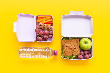 Healthy lunch boxes with sandwich and fruits. Healthy school meal