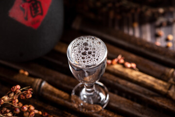 chinese liquor or baijiu in glass cup on table