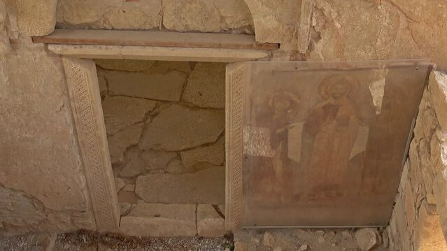 Demre, Turkey - 27th of October 2021: 4K Door and ancient sacred image behind protecting glass
