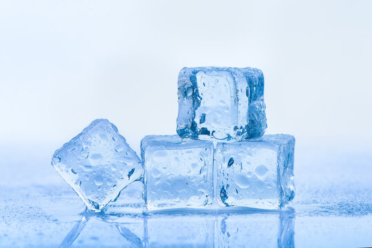 wet ice cubes on blue background