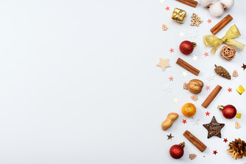 Christmas composition with cones, nuts, toys, cinnamon, Christmas balls on a white background. Isolate. New Year. Flat position, top view. Copy space for text