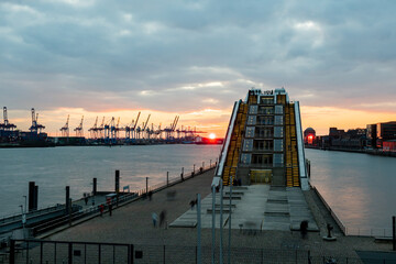 Hamburg, Elbe river, Germany: Harbor sunset scenery from Cruise Terminal Altona. View to the office...