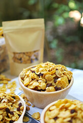 Close up honey caramel cornflakes with raisins and cashews