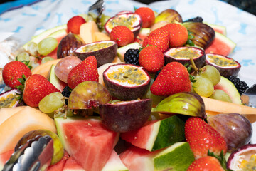colourful and delicious fruit salad strawberries, watermelon, kiwi fruit, berries made for a party