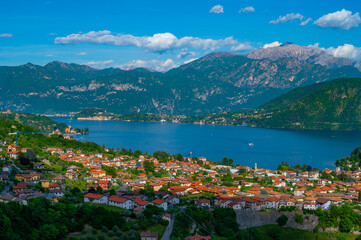 Fototapeta na wymiar The panorama of Lake Como photographed from the town of Colonno, showing the Northern Grigna, the Southern Grigna, Bellagio, and the town of Colonno. 