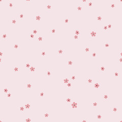 Seamless pattern with tiny pink flowers. Sakura background. Hand drawn vector illustration. Texture for print, textile, fabric, packaging.