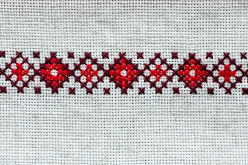 Fragment of traditional ukrainian embroidery on ukrainian rushnyk a linen cloth.