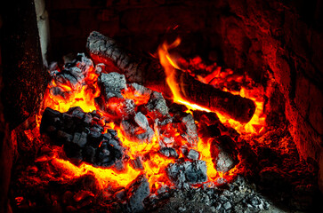 Hot coals in the fire. Coals in the sauna stove.