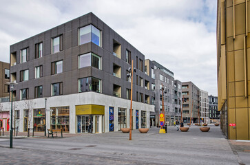 Reykjavik, Iceland, April 25, 2022: pedestrian shopping street with modern retail buildings in the...
