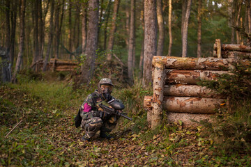 children playing paintball in the forest