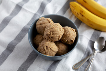 Homemade Peanut Butter Banana Ice Cream in a Bowl, side view.