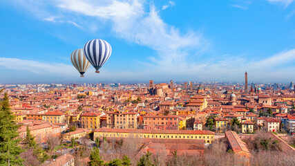 Hot air balloon flying over the red roofs of Bologna - Bologna, Italy 