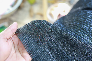 Black shading net pattern texture. Used in gardening, nurseries, agriculture. Texture, weave...