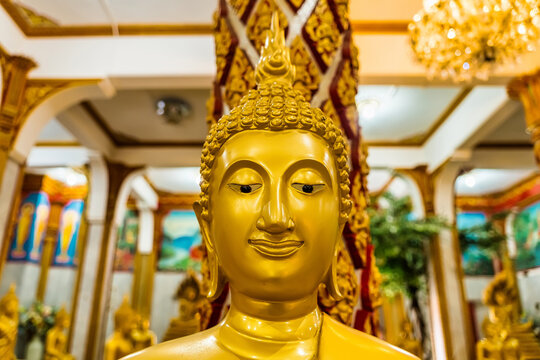 Phuket, Thailand - May, 07, 2022 : Buddhist statues of Wat Chalong in Phuket, Thailand