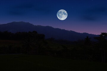 Fototapeta na wymiar full moon over the mountains