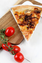 Carbonara pizza slice with cherry tomatoes