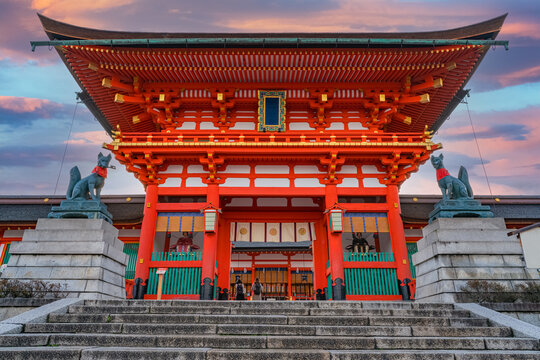 Fushimi Inari Shrine at sunrise, Kyoto, Japan. The japanese on the building means Fushimi Inari Shrine.