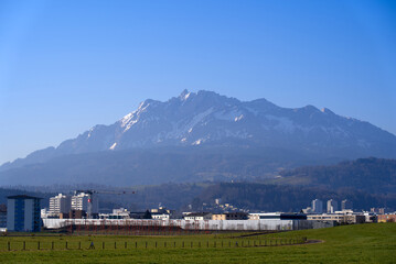 Panoramic view of Swiss Alps with mount Pilatus seen from Emmen Air Base on a sunny spring day. Photo taken March 23rd, 2022, Emmen, Switzerland.