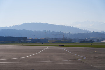 Panoramic view of Swiss Alps seen from City of Emmen on a sunny spring day. Photo taken March 23rd, 2022, Emmen, Switzerland.