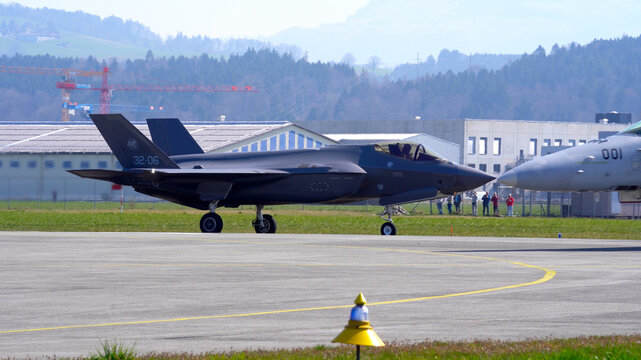 Fighter Lockheed Martin F-35 at Swiss Air Force Airbase Emmen, Canton Lucerne, taxiing to runway on a sunny spring noon. Photo taken March 23rd, 2022, Emmen, Switzerland.