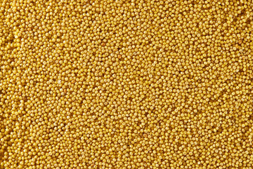 Top view image of yellow millet - wheat grain. Food natural background.