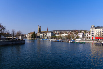 View over the medieval old town of Zürich with river Limmat and Protestant church Great Minster on a beautiful spring day. Photo taken March 28th, 2022, Zurich, Switzerland.