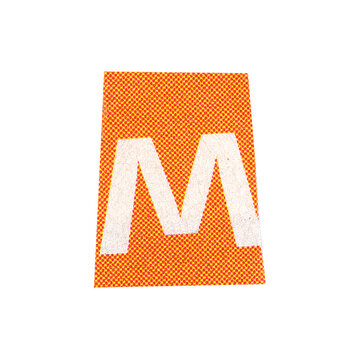 letter m magazine cut out font, ransom letter, isolated collage elements for text alphabet. hand made and cut, high quality scan. halftone pattern and texture detail. newspaper and scraps