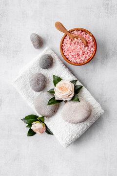Relax background - spa stones with roses and sea salt, top view