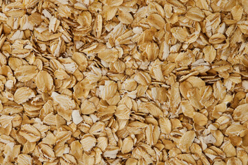 Closeup image of oats cereal background. Vegan healthy lifestyle. Natural food texture