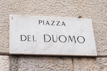 Piazza Del Duomo street sign in Milan historical central square. Cathedral Square marble plate.