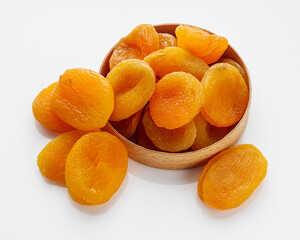 delicious dried apricots on a white acrylic background