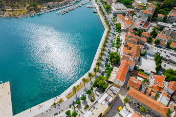 Embankment by the sea and hotels for tourists in the resort town. View from above.