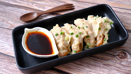 Top view  steam shrimp dumplings with soy sauce (gyoza or dim sum).