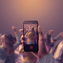 Woman shooting a video of a dance party
