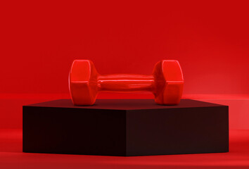 Dumbbells on black pentagon podium in the red studio