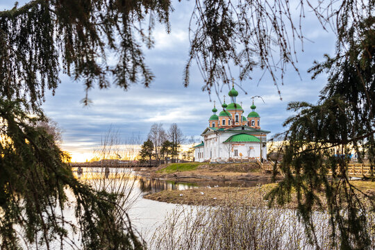 OLONETS, RUSSIA: View of the Smolensk Cathedral of the icon of the mother of God from the side of the river Megrega in twilight