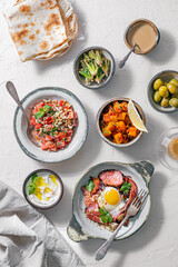 Healthy Turkish breakfast spread in the bright morning, white background