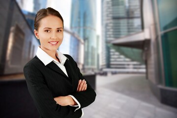 Businesswoman standing on the street of a city.