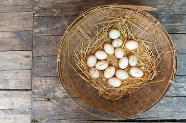 Brown eggs on rice straw. Easter Eggs in a woven bamboo basket