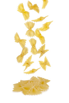 Tasty uncooked pasta on white background. Pile of uncooked pasta.