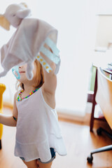Little girl playing with a puppet