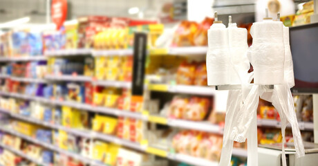 choosing a dairy products at supermarket.empty grocery cart in an empty supermarket