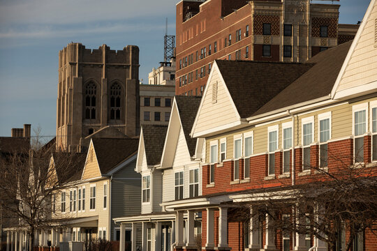 Afternoon light shines on housing and the historic skyline of downtown Gary, Indiana, USA.