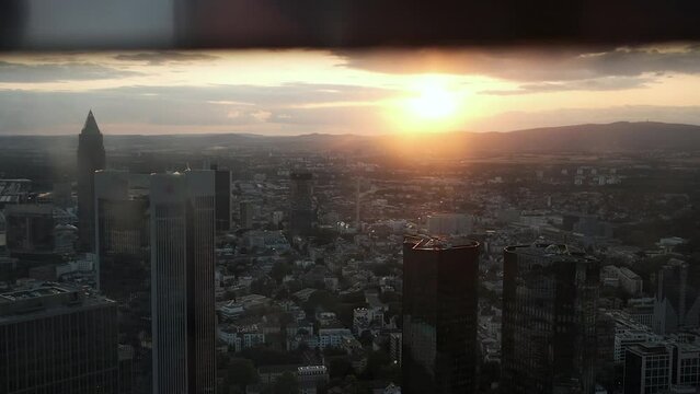 View from the skyscraper on the city from a height during the summer sunset. Incredibly beautiful in Frankfurt am Main