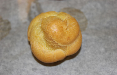 a perfect freshly baked cream puff in its typical golden color