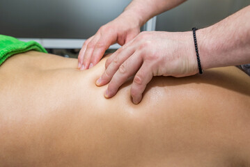 Back massage in a massage parlor. Body care concept
