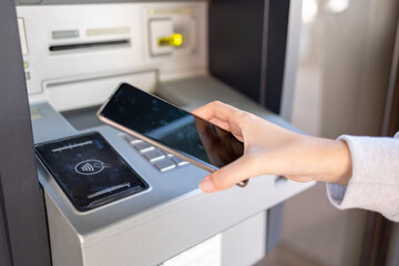 Using NFC technology at an ATM with a smartphone