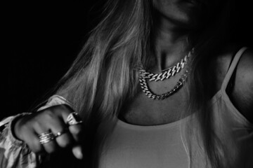 Female rapper showing fist over black background
