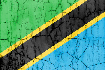 Textured photo of the flag of Tanzania with cracks.
